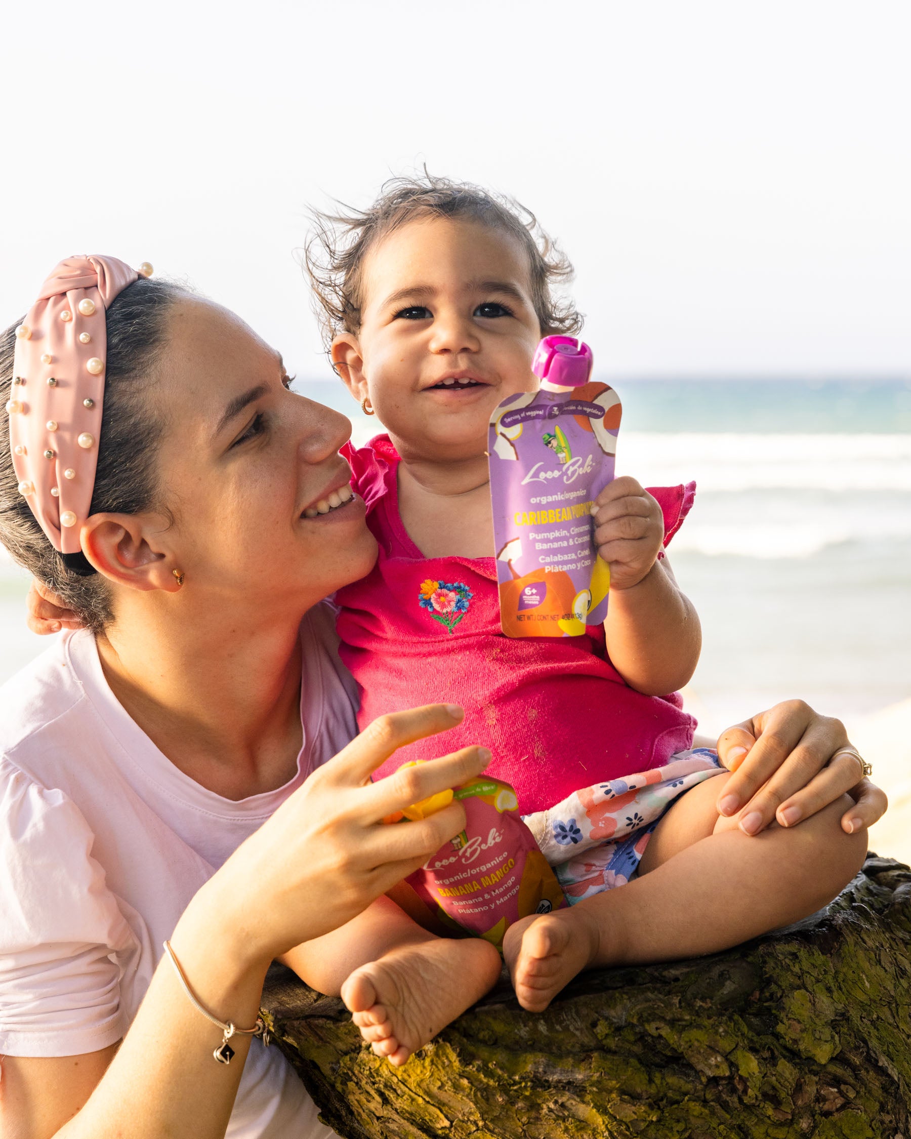 Loco Bebe Organic Caribbean Pumpkin Puree baby food pouch with toddler and mom at the beach smiling